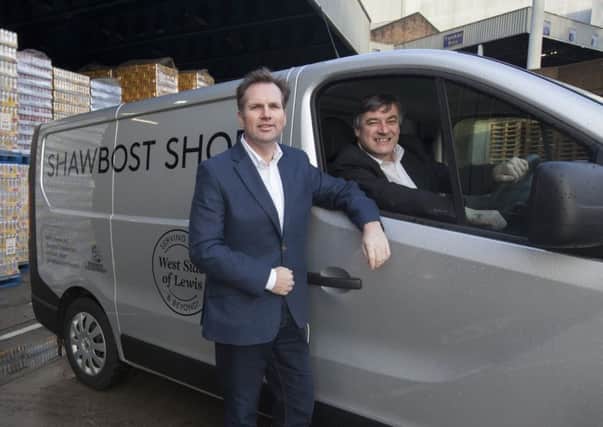 Alastair Campbell, managing director of Tennent Caledonian, with Shawbost owner Michael Fitzpatrick