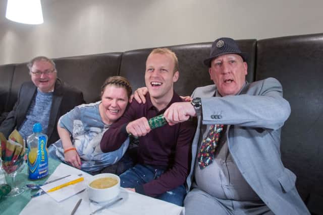 Steven Naismith at the Loaves and Fishes Christmas Lunch for the homeless in Glasgow with Wendy Brockett and James Goldie. Picture: Martin Shields