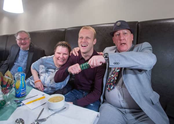 Steven Naismith at the Loaves and Fishes Christmas Lunch for the homeless in Glasgow with Wendy Brockett and James Goldie. Picture: Martin Shields