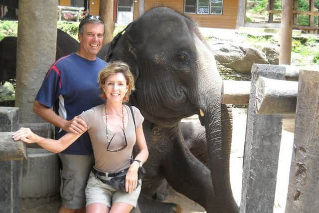 Skip and Gabrielle Yetter with an elephant in Cambodia