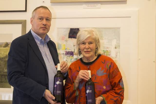 Scott Morris of Eat and Drink Italy with artist Pat Edgar, whose painting will feature on the firm's white wine labels