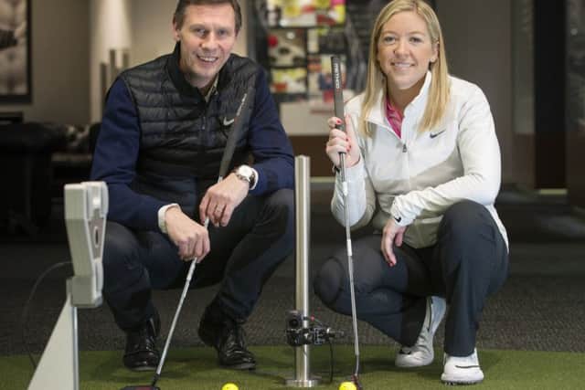 Tom Younger and professional Heather MacRae at Archerfields performance fitting centre, which is a hit with women learning golf. Picture: Lesley Martin
