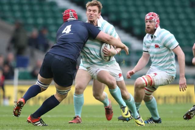 Cambridges Scottish stand-off Fraser Gillies is tackled by Oxfords Fergus Taylor in yesterdays Varsity match at Twickenham. Picture: Getty Images