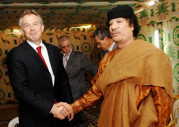 Prime Minister Tony Blair meets Libyan leader Colonel Muammar Gaddafi at his desert base outside Sirte south of Tripoli in 2007. Picture: PA