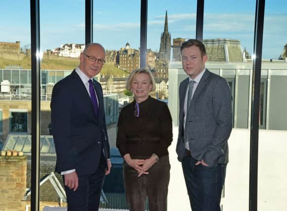 John Swinney with Moya Greene and Mallzee s chief executive Cally Russell at the firms new Edinburgh office yesterday. Picture: Jon Savage