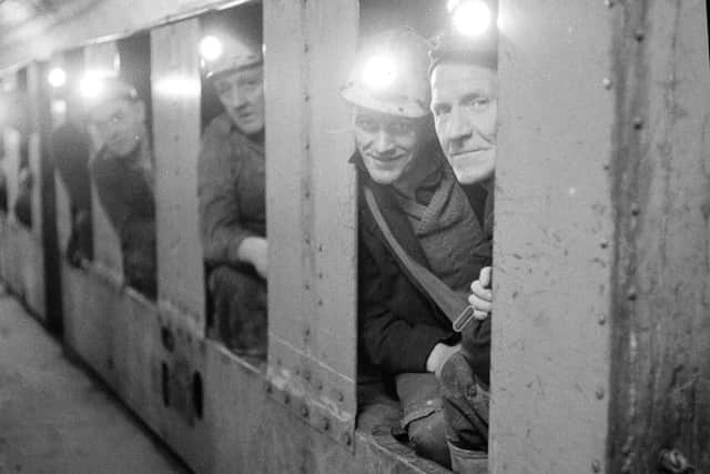 Miners travel to the coalface at Bilston Glen pit, Loanhead, Midlothian. The mine closed in 1989 and once employed 2300