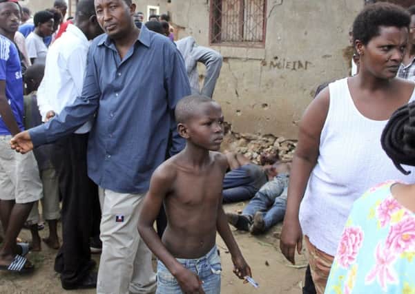 Bystanders at the scene of one of the attacks in Bujumbura. Picture: AP