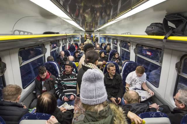 Commuters on a crowded service between Milngavie and Glasgow Queen Street. Picture: Robert Perry