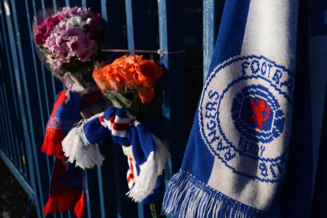 Tributes on the gates at Ibrox Stadium for Arnold Peralta. Picture: Hemedia