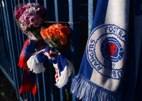 Tributes on the gates at Ibrox Stadium for Arnold Peralta. Picture: Hemedia