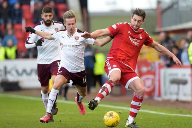 Hearts' Billy King, left, tussles with Ash Taylor. Picture: SNS