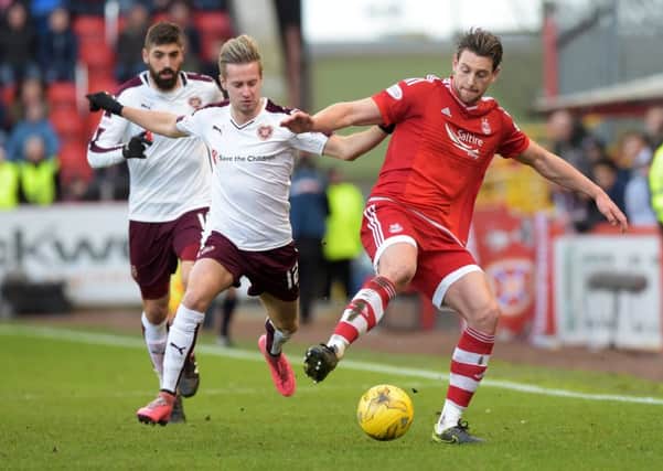 Hearts' Billy King, left, tussles with Ash Taylor. Picture: SNS