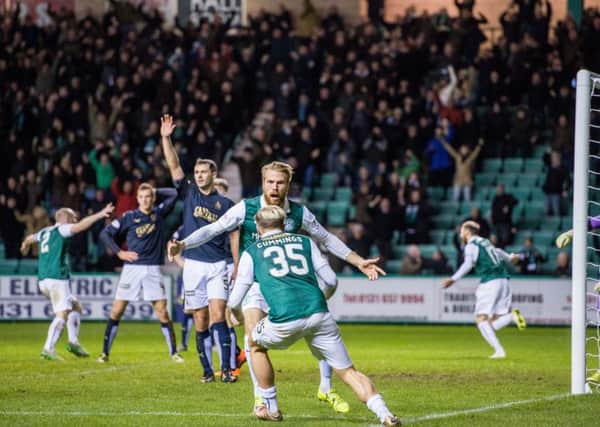 Hibernian celebrate their late equaliser. Picture: Ian Georgeson