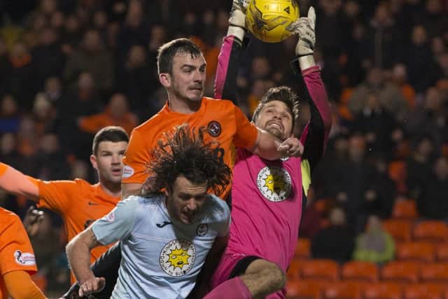 Partick Thistle goalkeeper Thomas Cerny challenges for the ball with Gavin Gunning. Picture: SNS