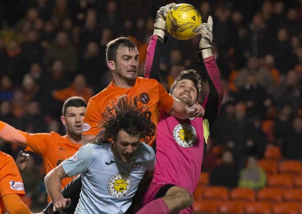 Partick Thistle goalkeeper Thomas Cerny challenges for the ball with Gavin Gunning. Picture: SNS