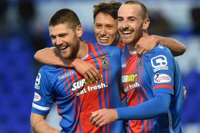 Iain Vigurs, left, is congratulated by team mates Danny Williams and James Vincent after adding Inverness CT's second goal of the game. Picture: SNS