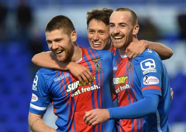 Iain Vigurs, left, is congratulated by team mates Danny Williams and James Vincent after adding Inverness CT's second goal of the game. Picture: SNS