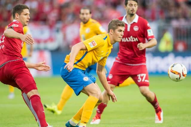 Stipe Vucur challenges Emil Berggreen during a Bundesliga clash between Kaiserslautern and Braunschweig. Picture: Getty Images