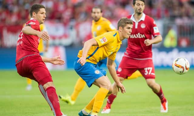 Stipe Vucur challenges Emil Berggreen during a Bundesliga clash between Kaiserslautern and Braunschweig. Picture: Getty Images