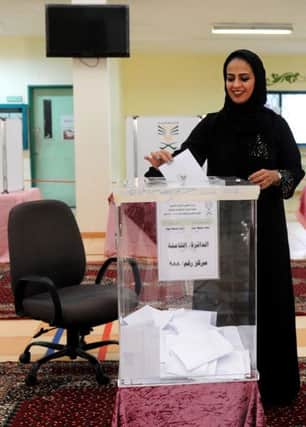 A Saudi woman casts her ballot at a polling station in the coastal city of Jeddah. Picture: AFP/Getty