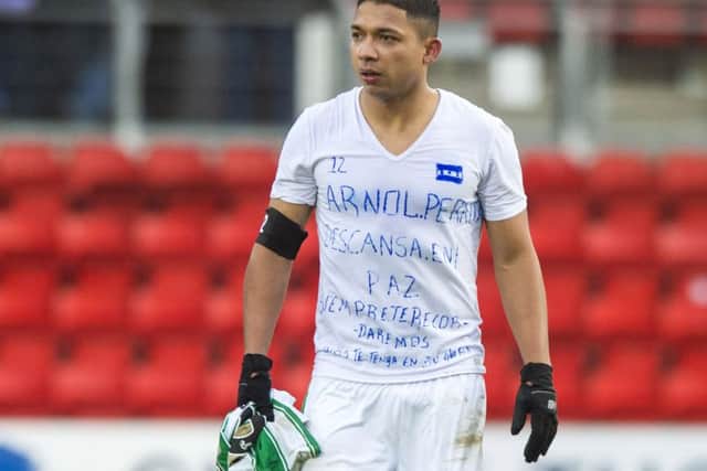 Emilio Izaguirre displays a message on his shirt for Arnold Peralta. Picture: SNS