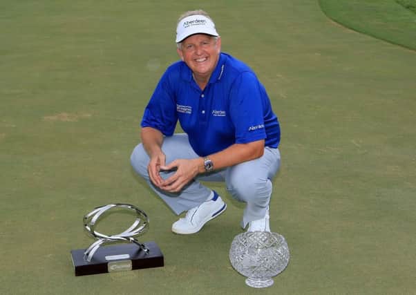Colin Montgomerie with the MCB trophy and the John Jacobs trophy after retaining his European Senior Tour Order of Merit title. Picture: Getty