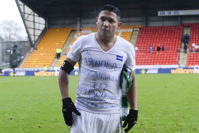 Celtic's Emilio Izaguirre displays a message on his shirt for late friend Arnold Peralta. Picture: SNS