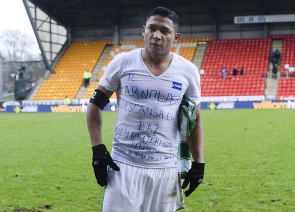 Celtic's Emilio Izaguirre displays a message on his shirt for late friend Arnold Peralta. Picture: SNS