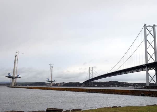 The Queensferry Crossing takes shape next to the Forth Road Bridge. Picture: Lisa Ferguson