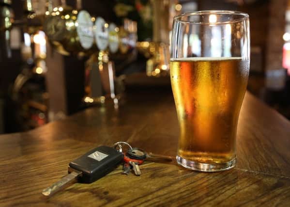 Almost half of motorists would call the police if they saw a stranger over the drink-drive limit get behind the wheel. Picture: PA