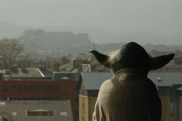Yoda enjoys the view of the Edinburgh skyline. The latest Star Wars film opens on Thursday. Picture: TSPL