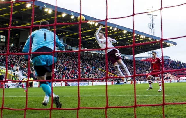 The bizarre moment at Pittodrie when Jordan McGhee reached up to handle Kenny McLeans cross in the box. Picture: SNS