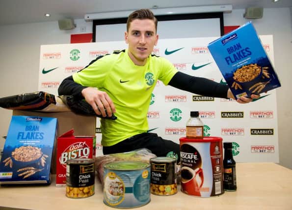 Paul Hanlon was at Easter Road yesterday to promote a Christmas food bank appeal to Hibs fans, who can bring donations to the ground before Saturdays game against Queen of the South. Picture: SNS