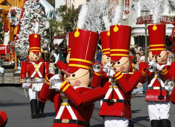 Toy soldiers celebrate the season as they march down a Disneyland thoroughfare. Picture: Disneyland Resort