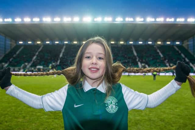 Sarrah took part in a sponsored haircut on the pitch at half-time at the Hibs Match at Easter Road.  Picture: Ian Georgeson.