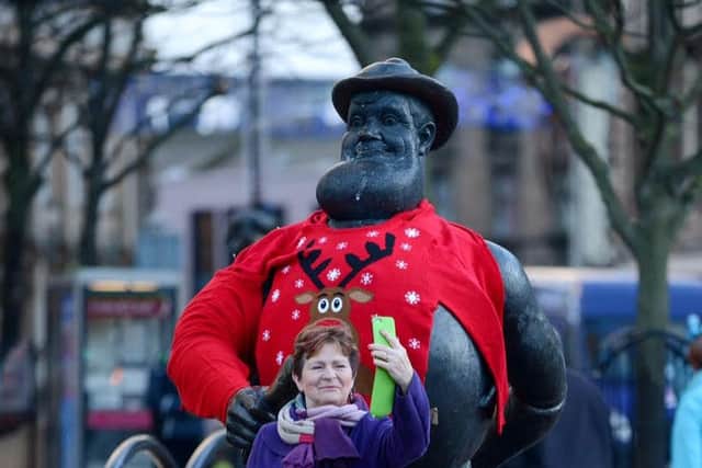 The Desperate Dan  statue in Dundee dressed in Christmas jumpers as part of Macmillan's  Text Santa Christmas appeal.