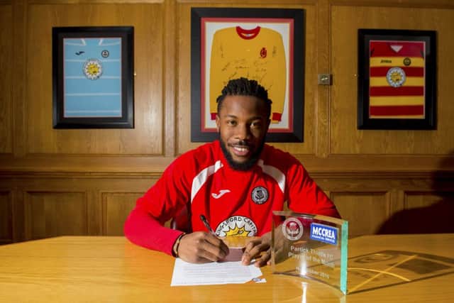 Partick Thistle's Mustapha Dumbuya is happy to have signed a contract extension at the club. Picture: SNS