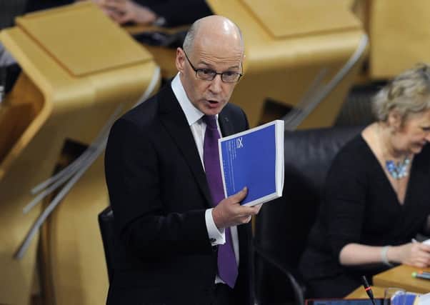 The anti-austerity rhetoric of John Swinney may ring hollow when the burden is passed to local authorities. Picture: Neil Hanna