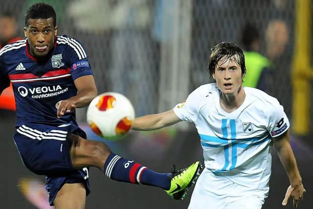 Ivan Mocinic, right, challenges Lyon's Alessane Plea during a Europa League clash. Picture: AFP/Getty