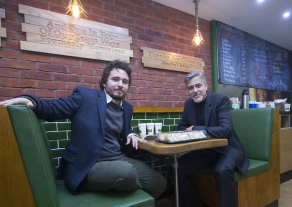 Social Bite co-founder Josh Littlejohn with George Clooney. Picture: Jeff Holmes/PA Wire