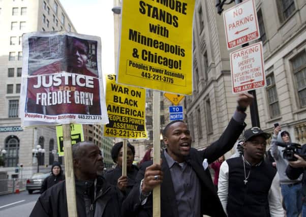 Demonstrators protest outside court in Baltimore in response to the announcement of a mistrial. Picture: AP