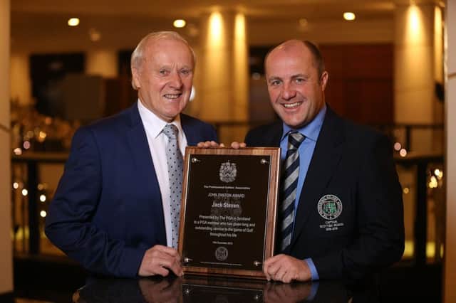Jack Steven, left, receives his award for outstanding service to golf from PGA in Scotland captain Stuart Syme in Glasgow. Picture: Contributed