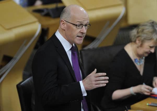 Finance Secretary John Swinney unveiled his draft budget to MSPs in the Scottish Parliament yesterday. Picture: Neil Hanna