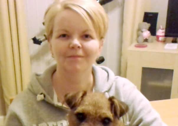 Victim Linda Carson with her dog Buster. Picture: Hemedia