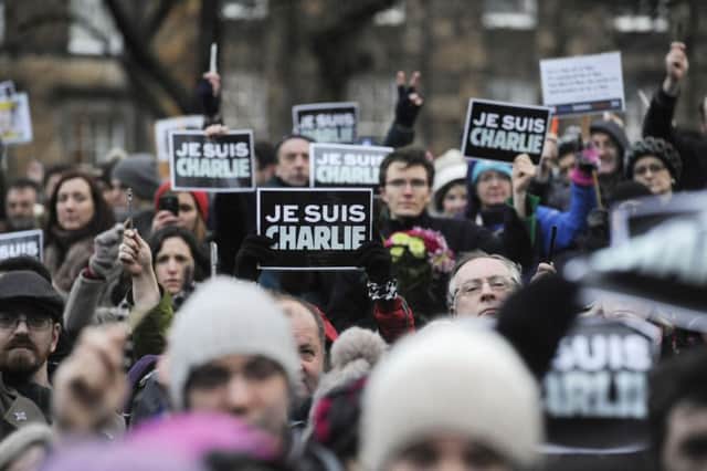 Crowds take to the streets ot Paris after the Charlie Hebdo attacks. Picture: Greg Macvean