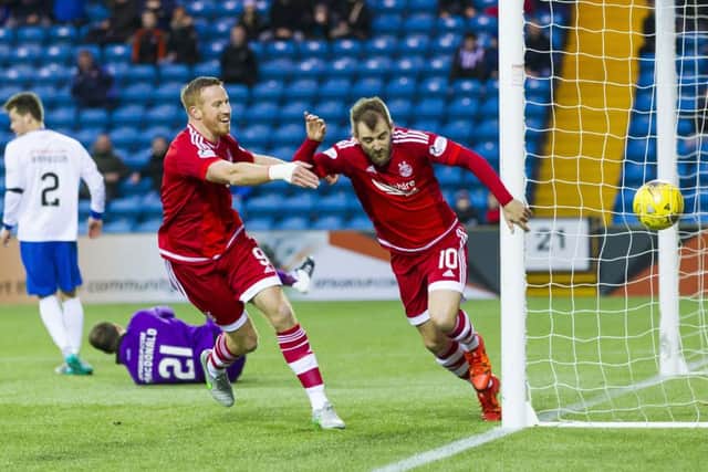 Aberdeen's Niall McGinn celebrates after heading home his sides opening goal. Picture: SNS