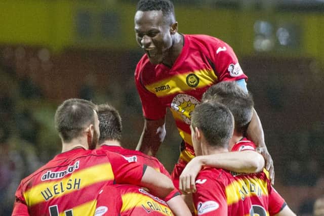 Partick Thistle celebrate after Ross County score an OG. Picture: SNS