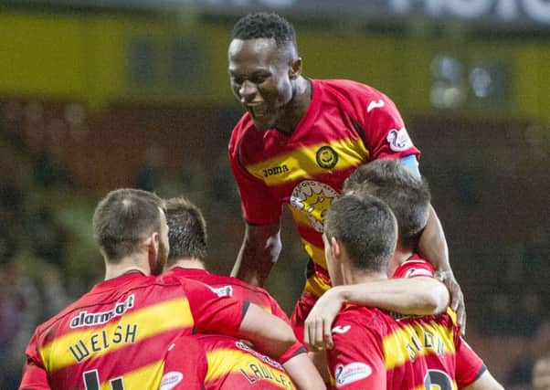 Partick Thistle celebrate after Ross County score an OG. Picture: SNS