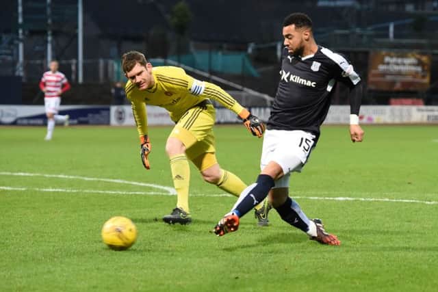 Kane Hemmings (right) slots the ball home to open the scoring for Dundee. Picture: SNS