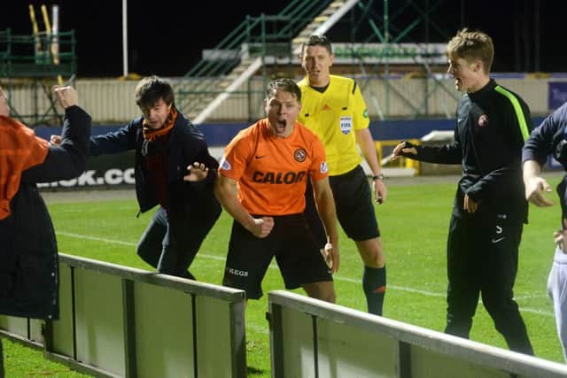 Dundee Utd's John Rankin celebrates after his side go 2-1 ahead. Picture: SNS